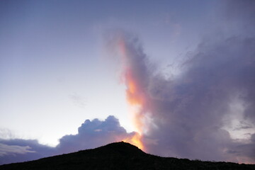 Sunrise view from the summit of Mount Rinjani. In the background is the Island of Sumbawa and Mount Tambora