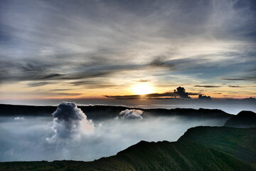 Sunrise view from the summit of Mount Rinjani. In the background is the Island of Sumbawa and Mount Tambora