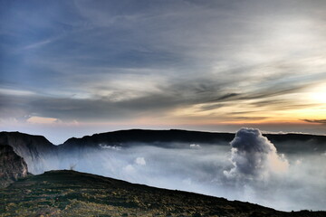 Sunrise view from the summit of Mount Rinjani. In the background is the Island of Sumbawa and Mount Tambora
