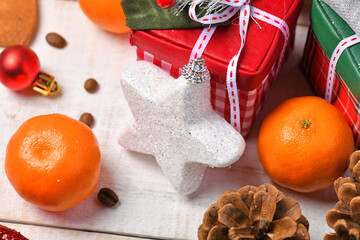 sweet food top view background for merry christmas or new year holiday decoration - chocolate candies, tangerines, cookies on white wood