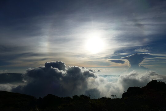 Sunrise view from the summit of Mount Rinjani. In the background is the Island of Sumbawa and Mount Tambora