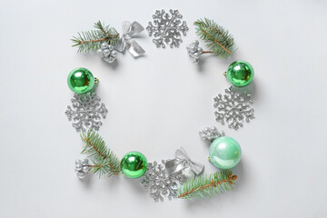Frame made of beautiful Christmas decor on light background