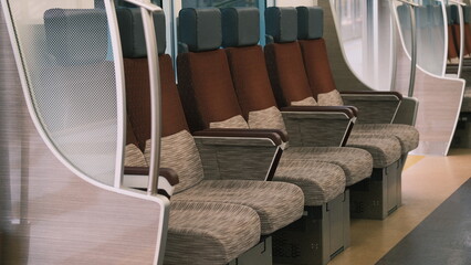 Obraz premium Clean train seats in a row with burgundy trim