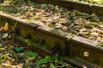 Low angle view of small railway tracks in mountain region with shallow depth of field