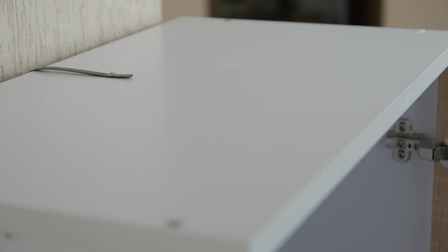 Secure furniture protection tip over opens a wardrobe closeup