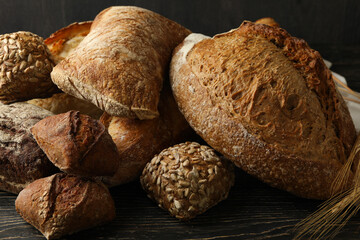 Different fresh bakery products on wooden background