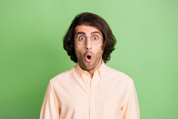 Portrait of nice amazed stunned cheery guy nerd geek pout lips unbelievable news isolated over...