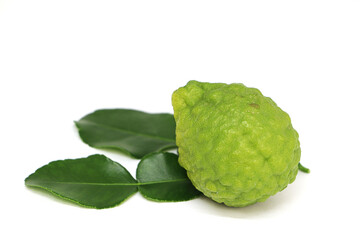 Fototapeta premium Close up a kaffir lime isolated on white background
