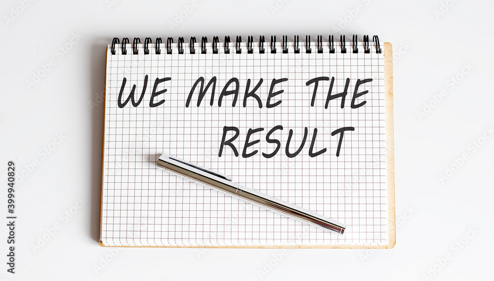 Poster notepad with text we make the result on a white background,business concept.