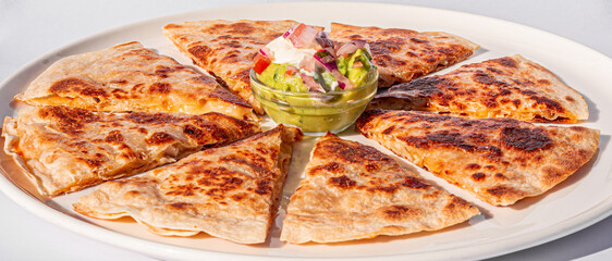 mexican quesadilla with chicken cheese guacamole and pico de gallo