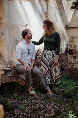 Engagement photo session of a young couple in the countryside. Caucasian couple, with a modern style. Family enjoying tender moment, happy marriage. family concept