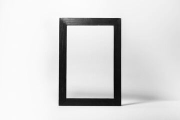 Close-up of black wooden frame  isolated on white background with empty space.
