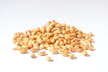 peeled peanuts on a white background