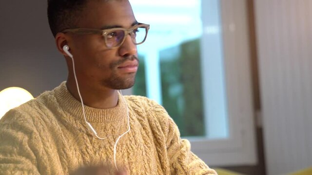 Portrait of african american trendy guy in a distant online call