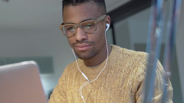 Portrait of african american trendy guy in a distant online call