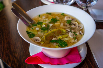 Noodle Bowl With vegetables and dumplings. Close up of a bowl Chinese style on wooden background .