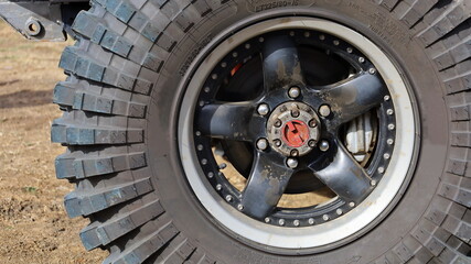 Locking hubs and wheels. Manual locking hub on the front wheel hub with four-wheel drive tires for access to the backcountry with copy space. Choose content and focus