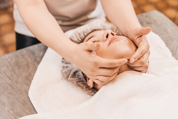 Obraz na płótnie Canvas Facial massage is an exercise for the face, as a result, the skin becomes smooth, healthy, elastic - massage helps fight wrinkles.