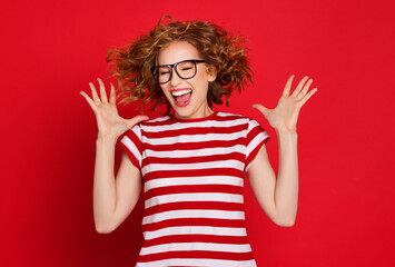 Young woman screaming in excitement.