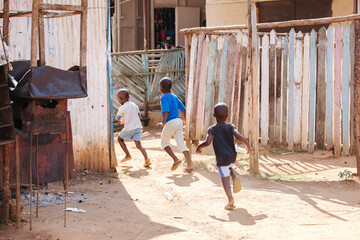 boy running in Uganda, Africa