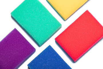 Sponge for washing dishes on a white background . Household items. Clean dishes. Help in the kitchen. Colored sponges. Copy space.