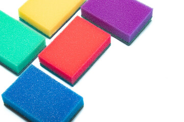 Sponge for washing dishes on a white background . Household items. Clean dishes. Help in the kitchen. Colored sponges. Copy space.
