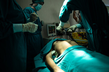 professional surgery team in the operating room, urgent surgery. Professional smart intelligent...