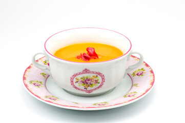 Delicious vegetable soup in bowl on white background