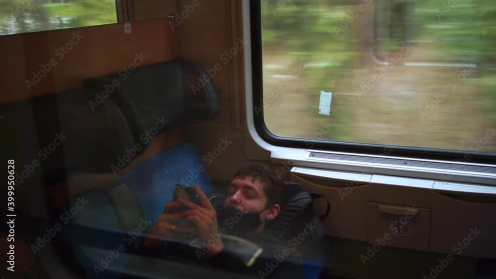 Poster communication person on a journey. using mobile application. reading an e-book. the man uses a cell 