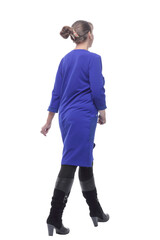 Naklejka premium Business woman in blue dress walking away
