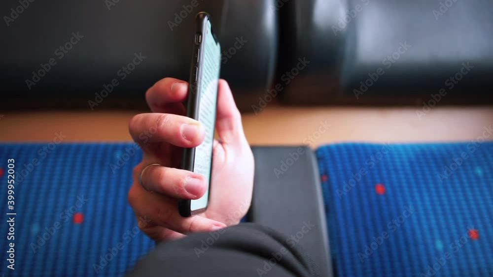 Poster communication of a person on a journey. using the mobile application. reading an e-book. the man use