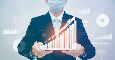 Businessman holding tablet bar graph of analytics and financial, Changes in new planning, Business...