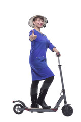 Full length profile shot of an woman with a scooter isolated on white background