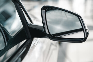 Mirror of a new white luxury car