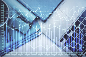 Double exposure of forex graph drawing over desktop background with computer. Concept of financial analysis. Top view.