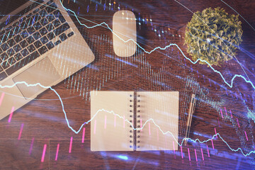 Stock market graph and top view computer on the table background. Double exposure. Concept of financial education.