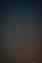 Starry night sky vertical high resolution photo.