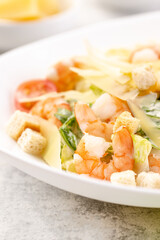Shrimp salad with fresh vegetables, cheese and croutons.