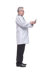 Side view of male doctor looking at smart phone screen with smile