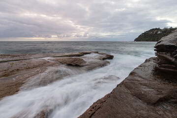 Water flowing in the rocky coastline.
