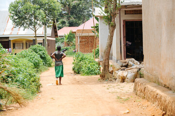Woman walking down the road in Entebbe, Uganda