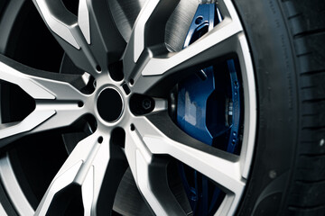 Aluminium rim of luxury car wheel close up