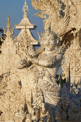 Fototapeta premium Magnificently grand white church and reflection in the water, Rong Khun temple, Chiang Rai province, northern Thailand