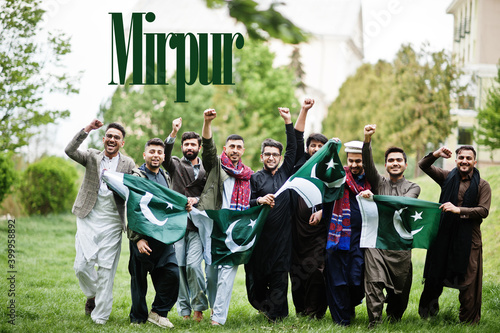 Mirpur city. Group of pakistani man wearing traditional clothes with national flags. Biggest cities of Pakistan concept.