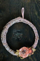 Christmas wreath made of twigs with flowers. High quality photo