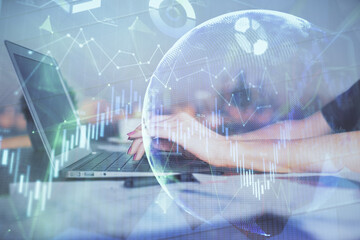 Double exposure of businesswoman hands typing on computer and forex chart hologram drawing. Financial analysis concept.