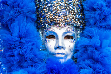 Venice, Italy - February 16, 2020: An unidentified person in a carnival costume in Piazza San Marco...