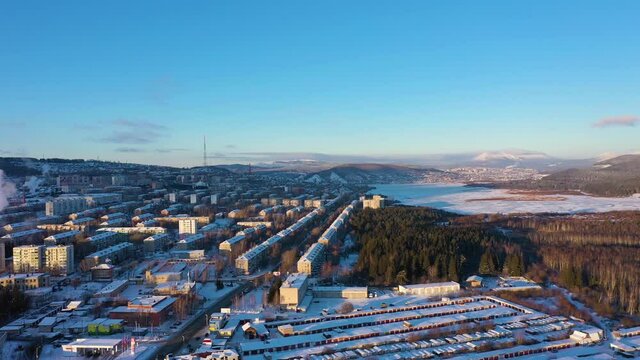 Zlatoust City on a Winter Sunny Day. Aerial View. Chelyabinsk Oblast. Russia. Drone Flies Sideways and Upwards