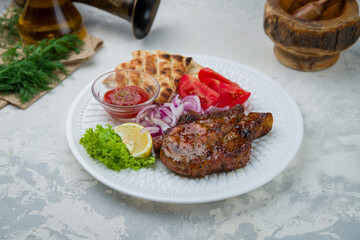 Fried pork loin with sauce and pita, greek style kitchen