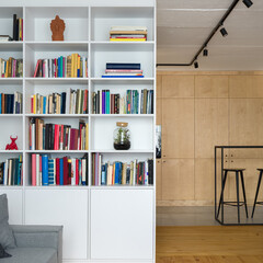 Stylish white bookcase with many decorations © Dariusz Jarzabek